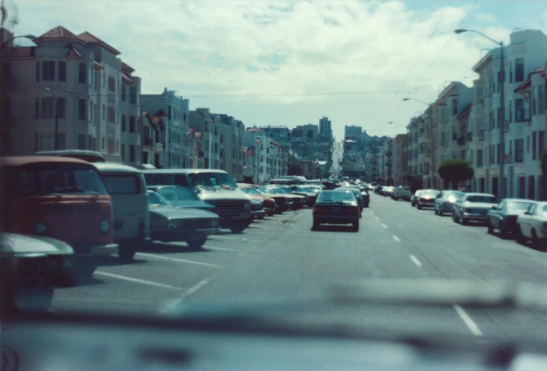 a car is seen driving down the city street