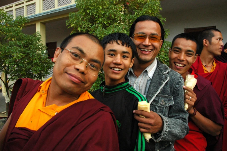 a group of young men are posing together