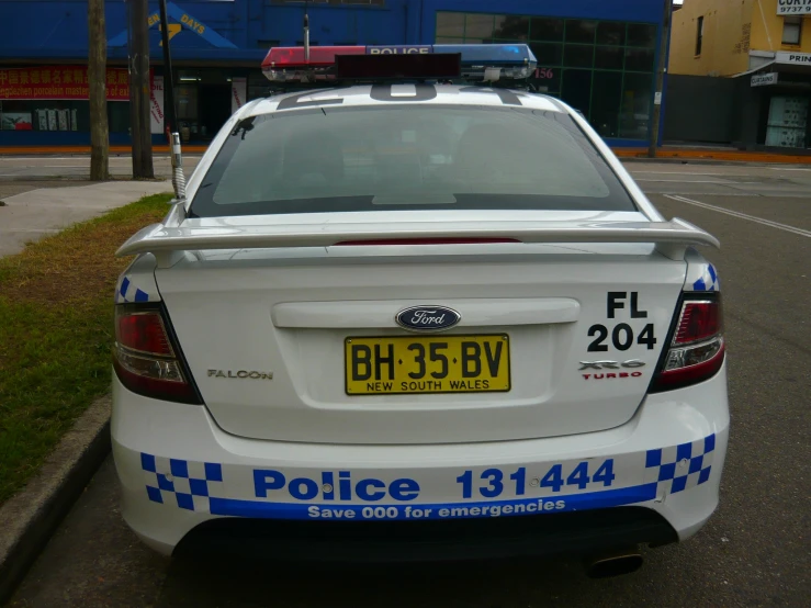 a police car parked in front of a building