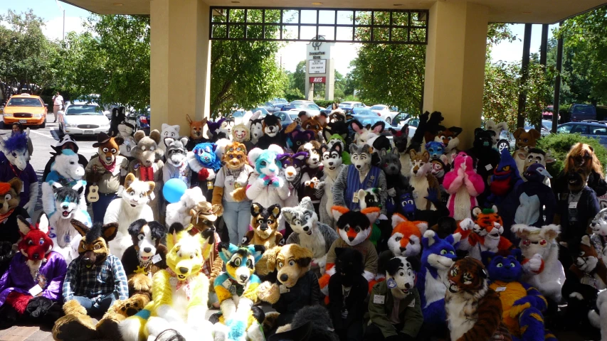 large group of different people dressed up in costume