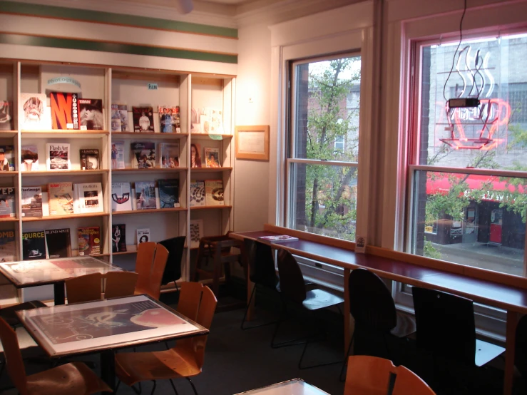 this is an image of a room with a window and book shelves