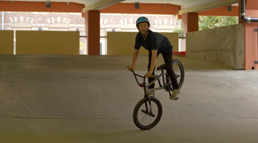 a man jumping his bicycle in the air