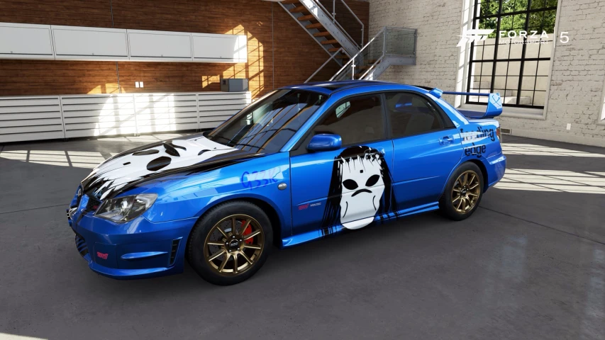 a blue car with two skull on the hood