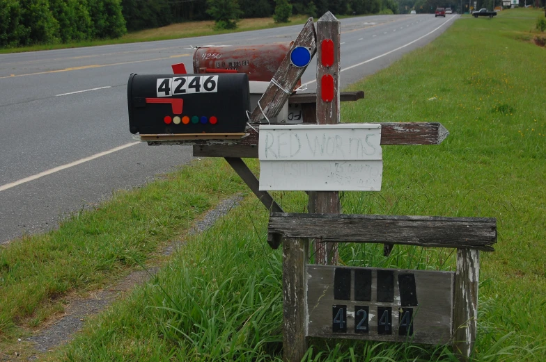 a wooden mailbox with a letter attached to it