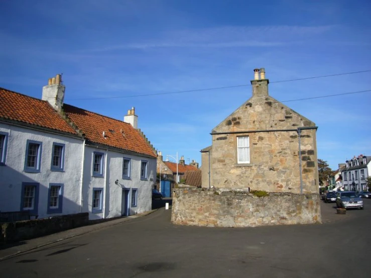 a cobble stone street lined with old buildings