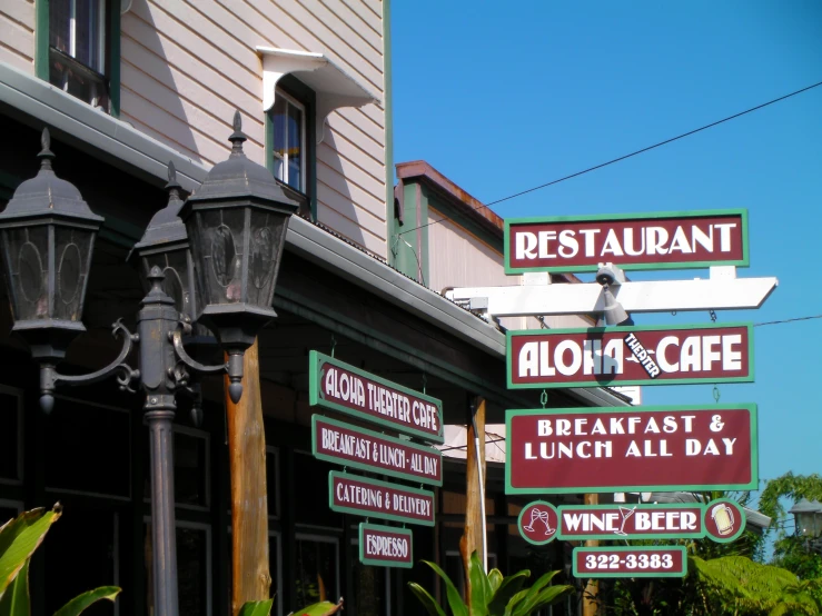 signs indicate restaurants are coming up at the shops