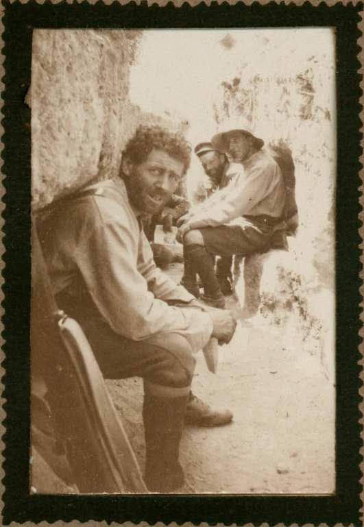 a couple of men sitting next to each other