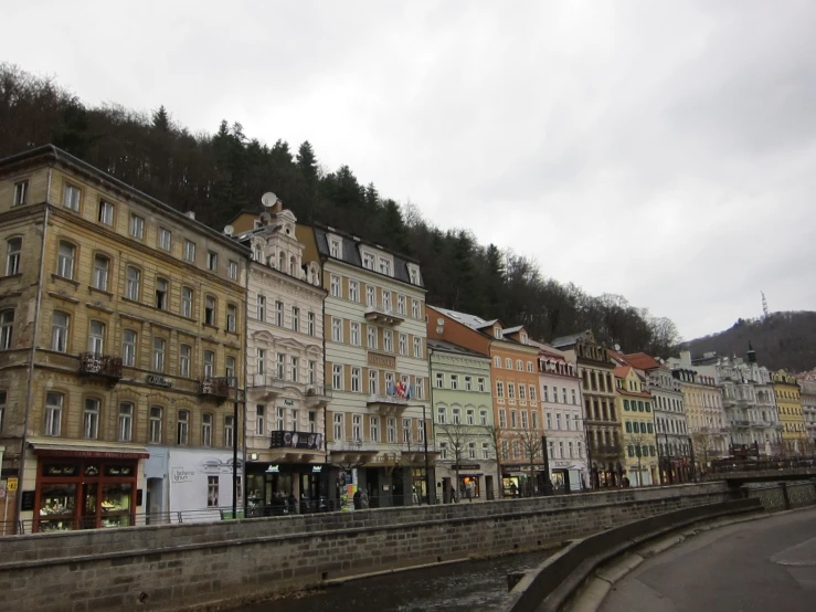 old buildings in the city with a mountain in the background