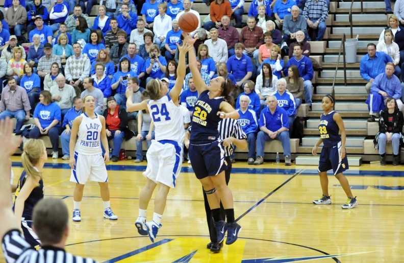 the crowd watches as a player takes a s from the court