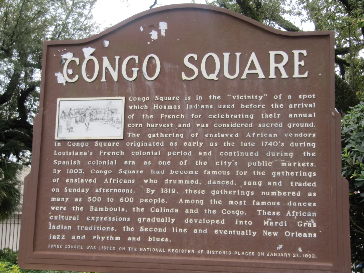 a sign that is showing the entrance to the town square