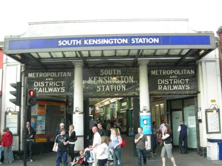 group of people walking in and out of south kingston station