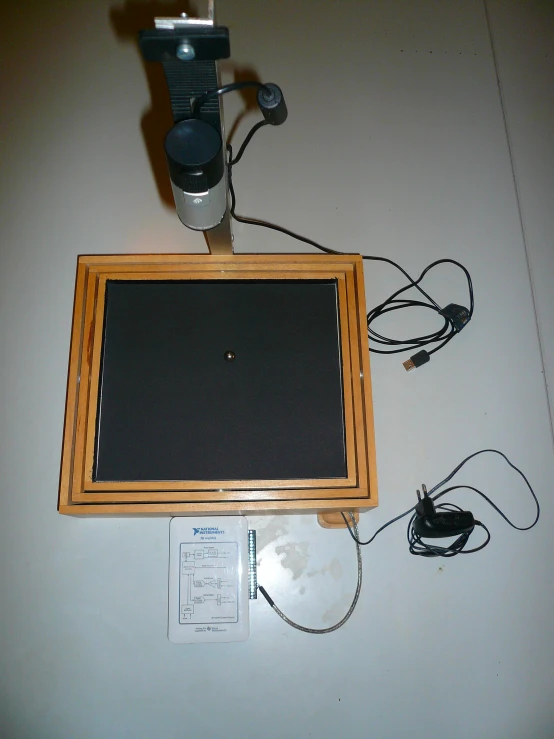 a camera mounted to a wall next to an electronic device