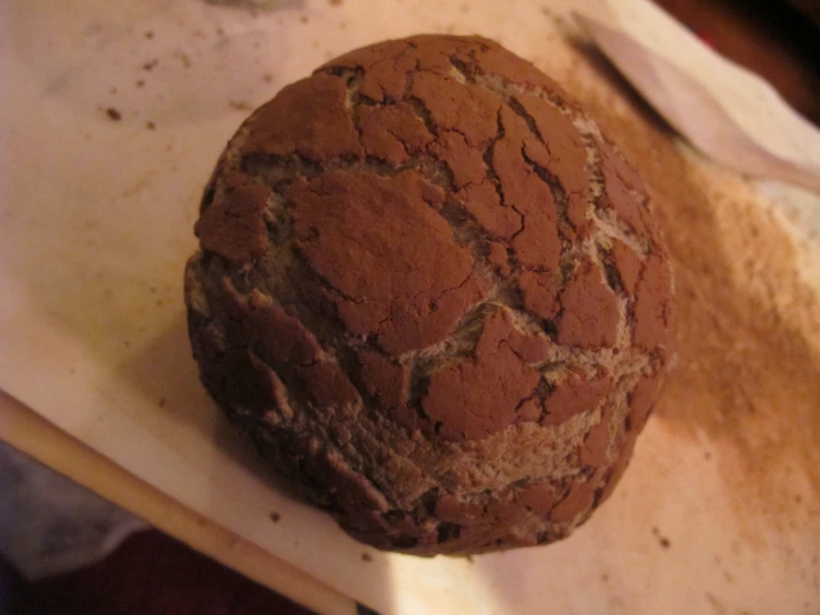 an uncooked round bread is on a table