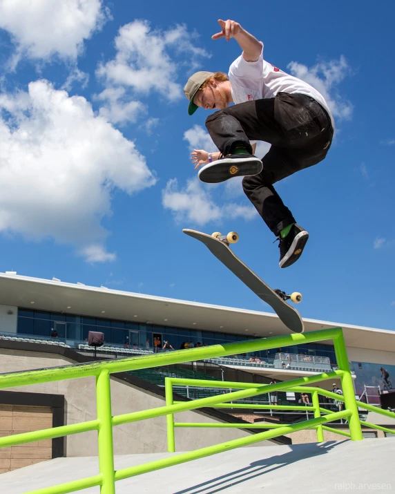 a man is riding his skateboard down the rail