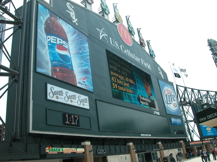 there is an advertit on the side of a large stadium