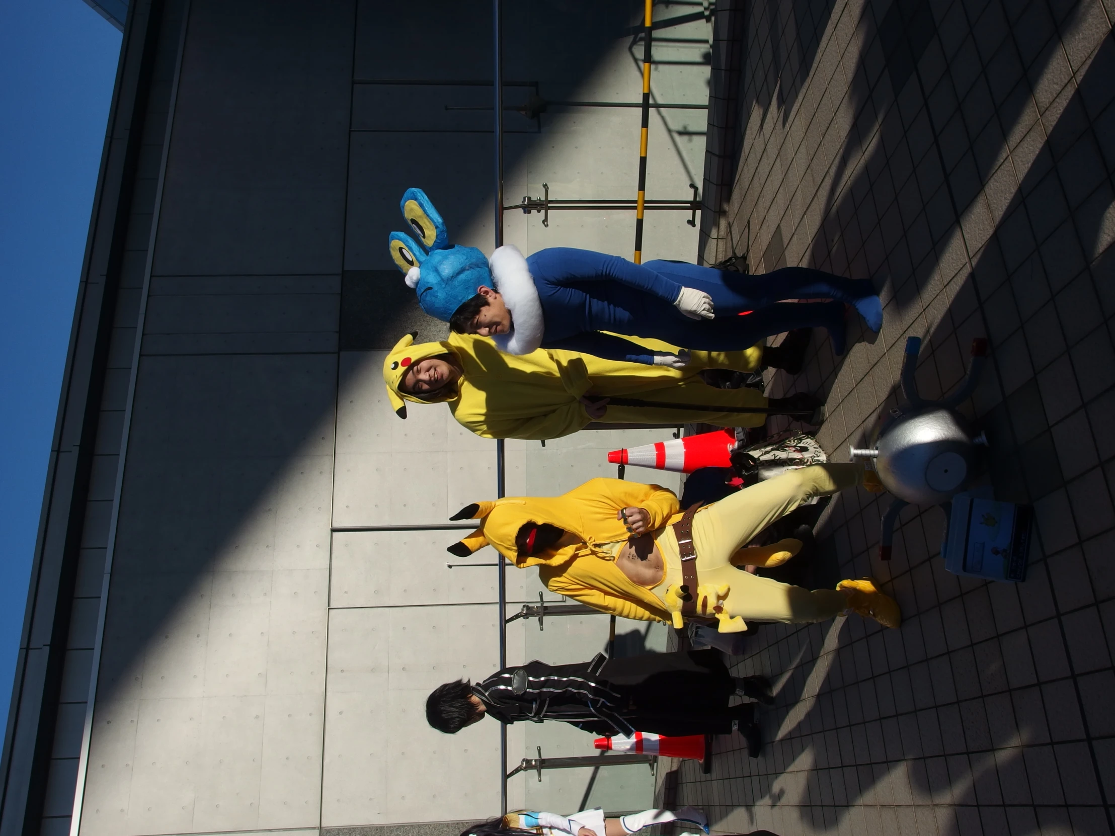 several men are in costumes next to a building