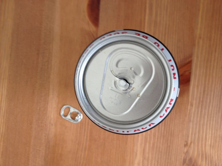 can of soda sitting on top of a table