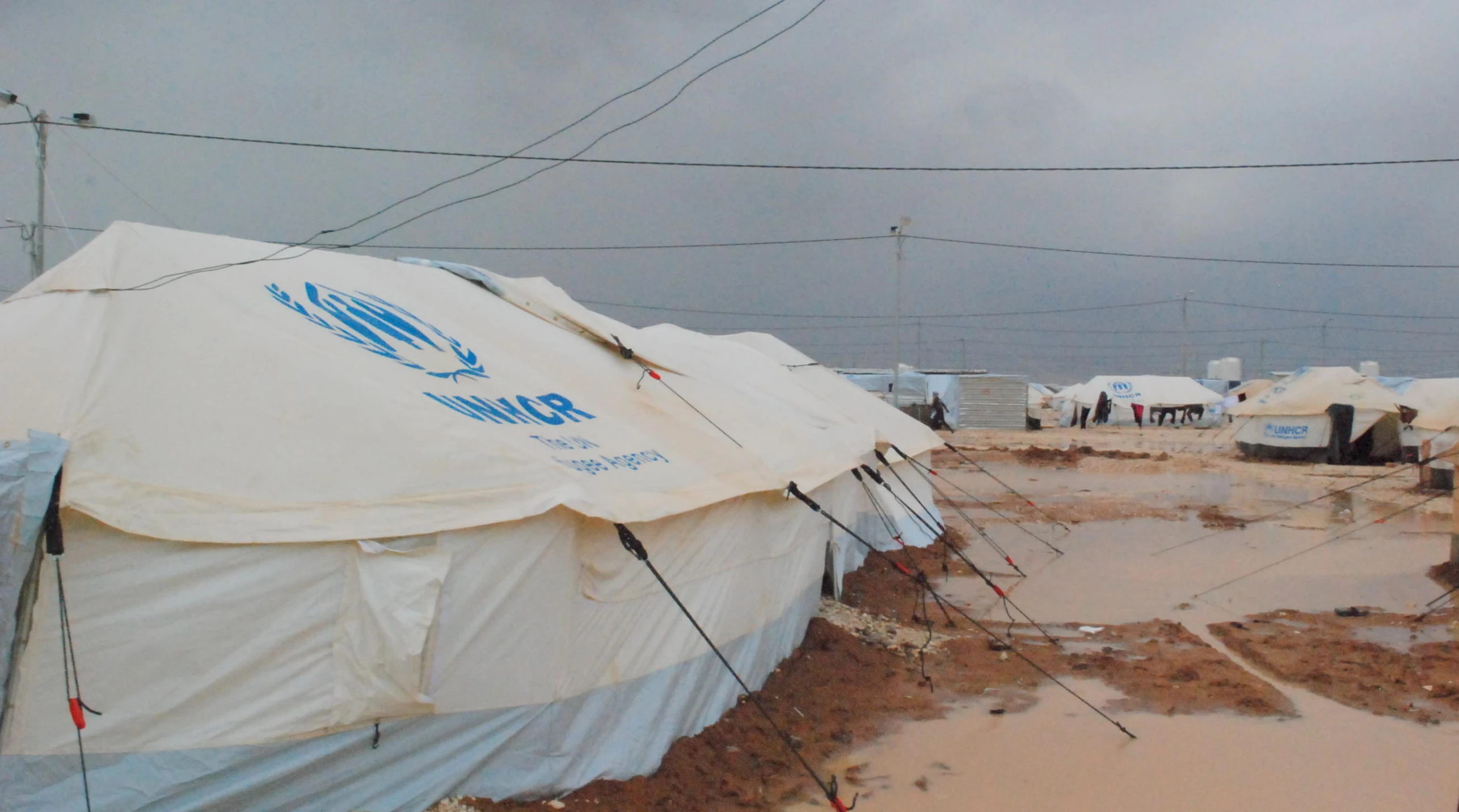 this is an image of many tents near water