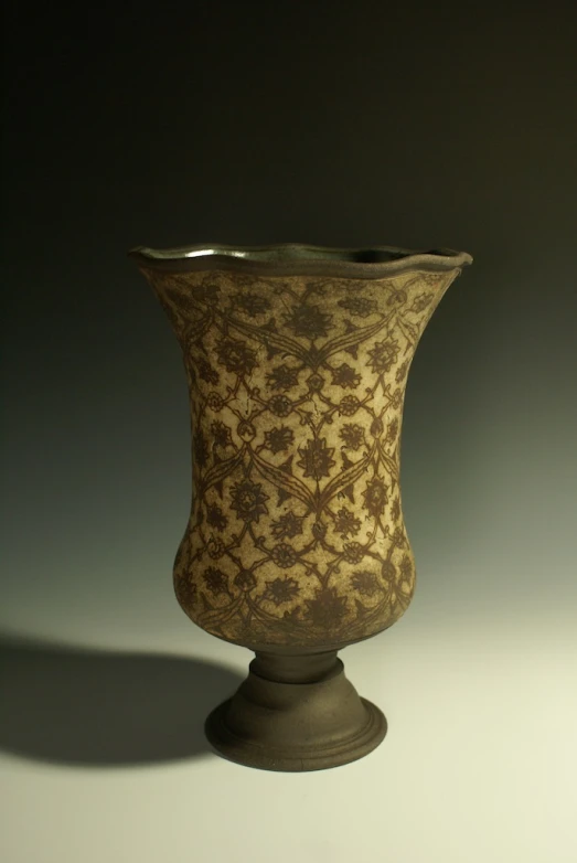 a fancy vase is sitting on a table