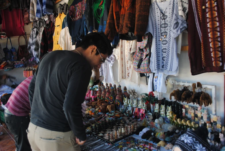 there are several colorful objects on display at the market