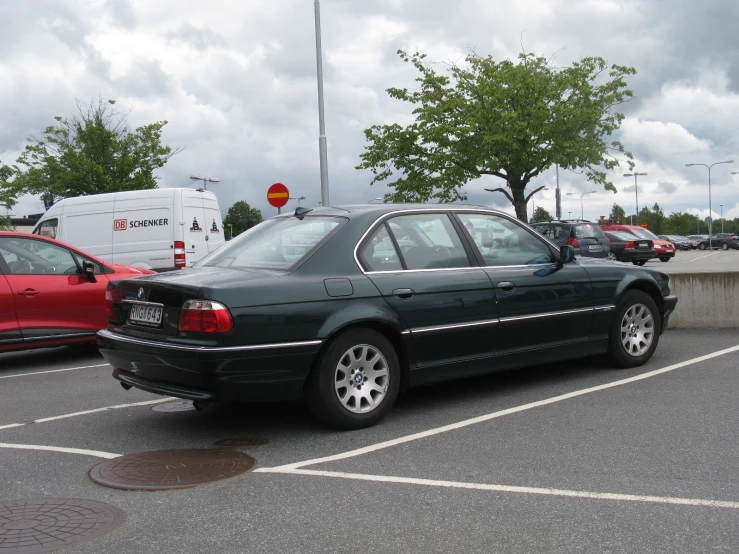 a car in a parking lot next to other cars