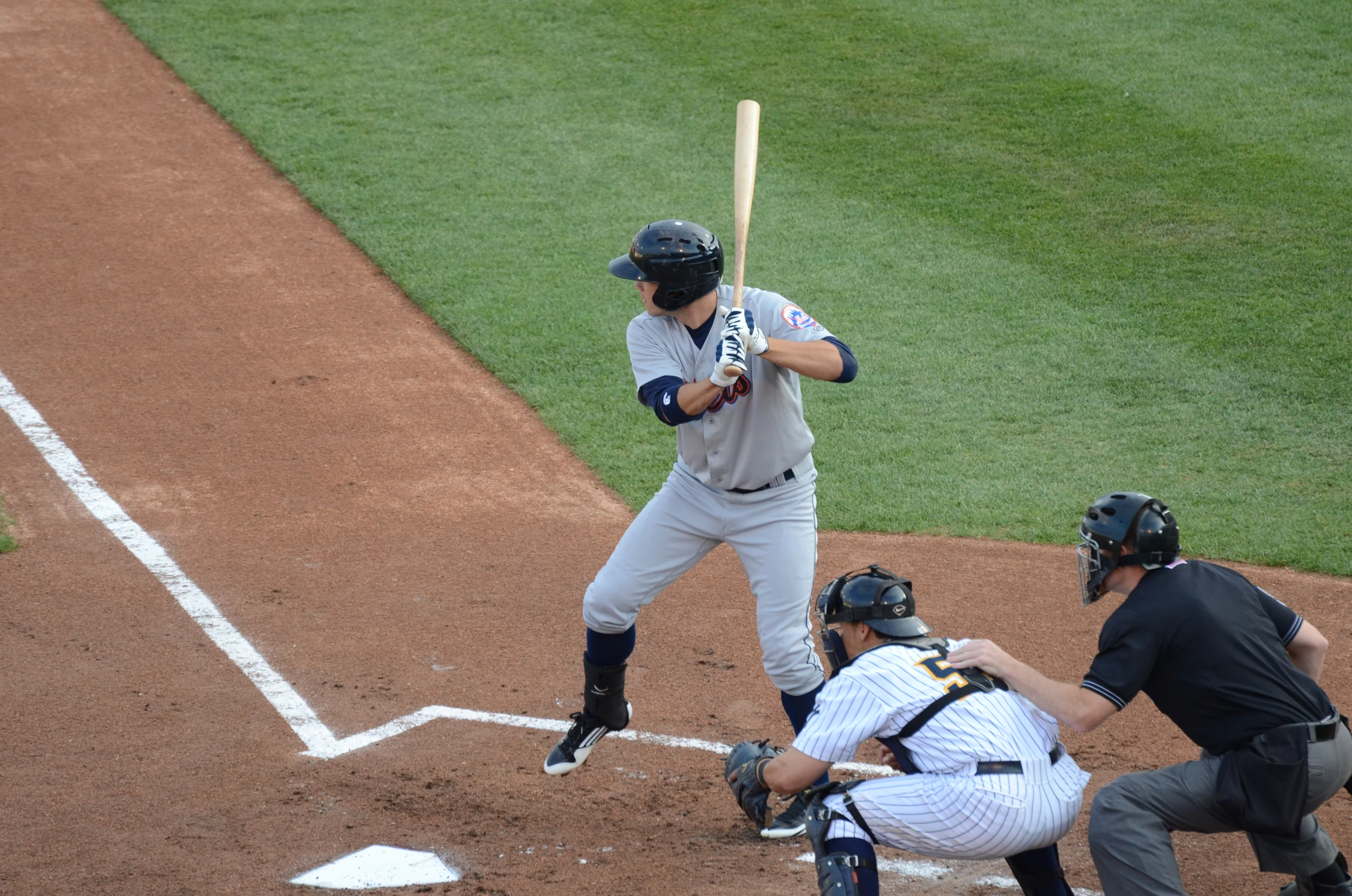 baseball batter getting ready to hit the ball at home plate