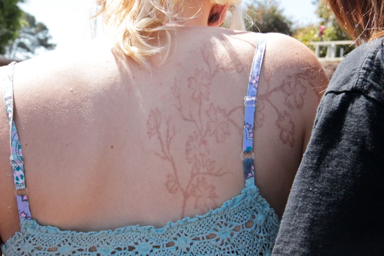 a woman with flowers on her back