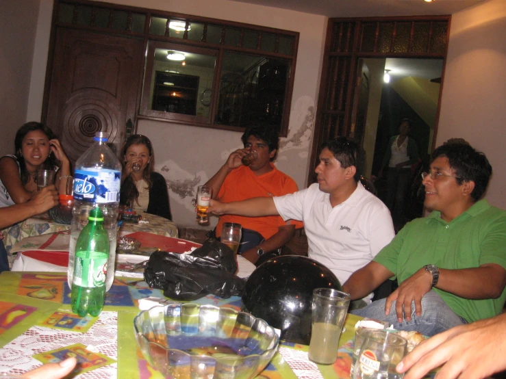 a group of people sitting at a table in a room