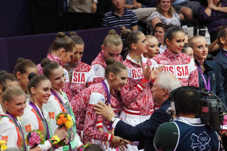 a group of young women who are standing together