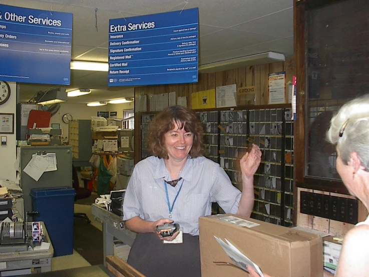 a lady talking to her customer in a bank