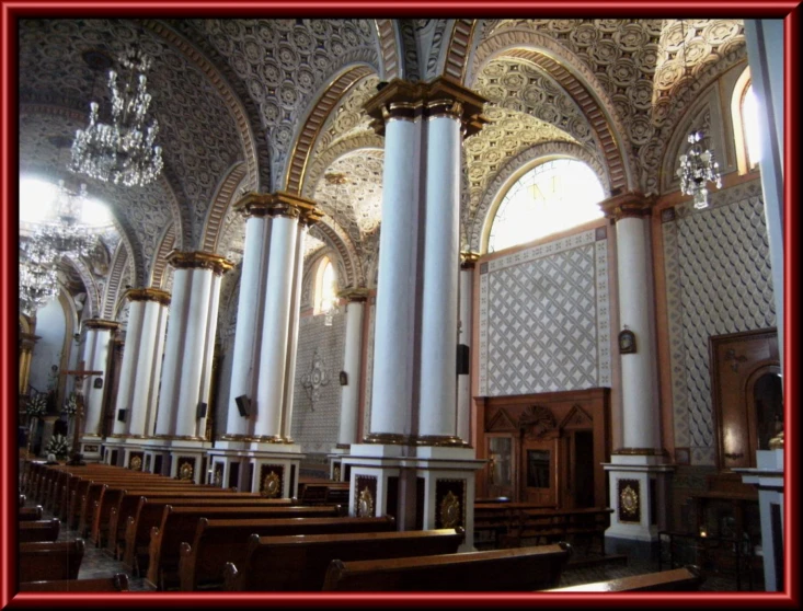 several windows are above the pews in this church