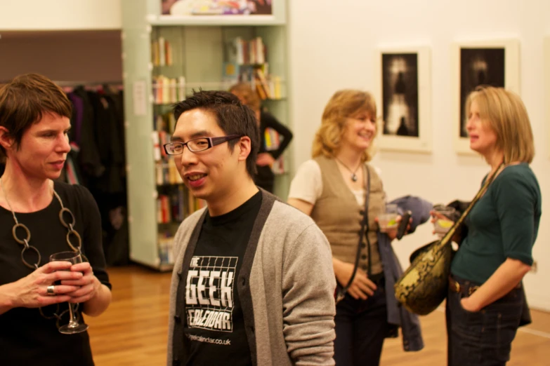 a man standing in front of people looking at soing