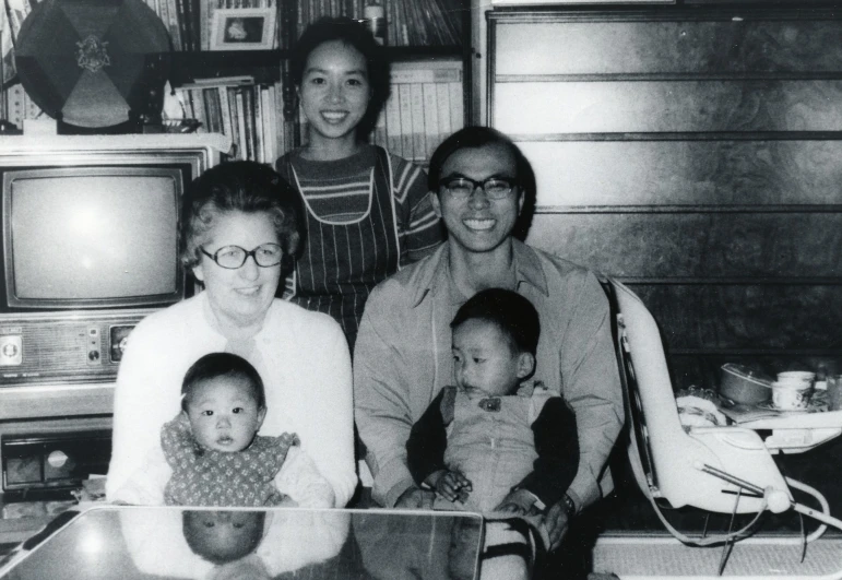 black and white pograph of a family posing for a po