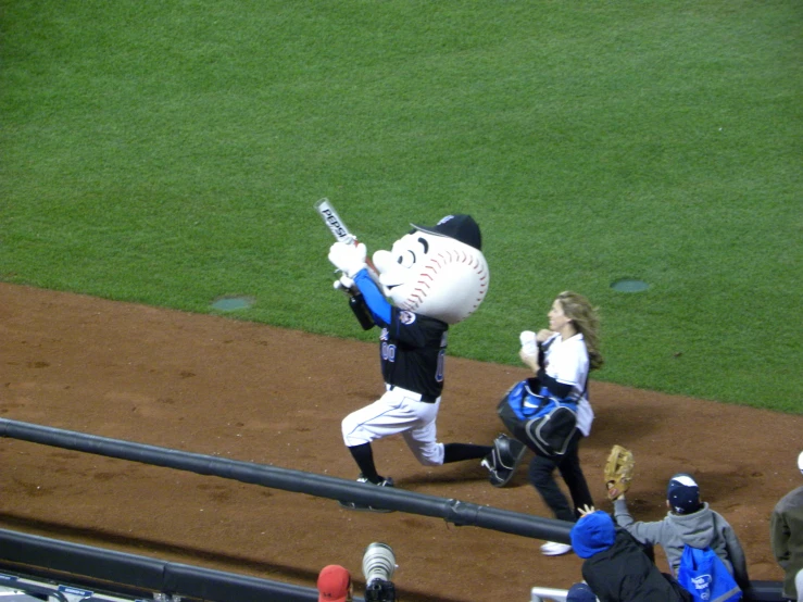 a batter has his bat raised and people look on