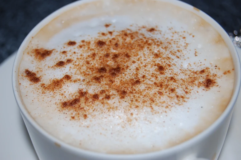 a close up view of a cup with coffee on it