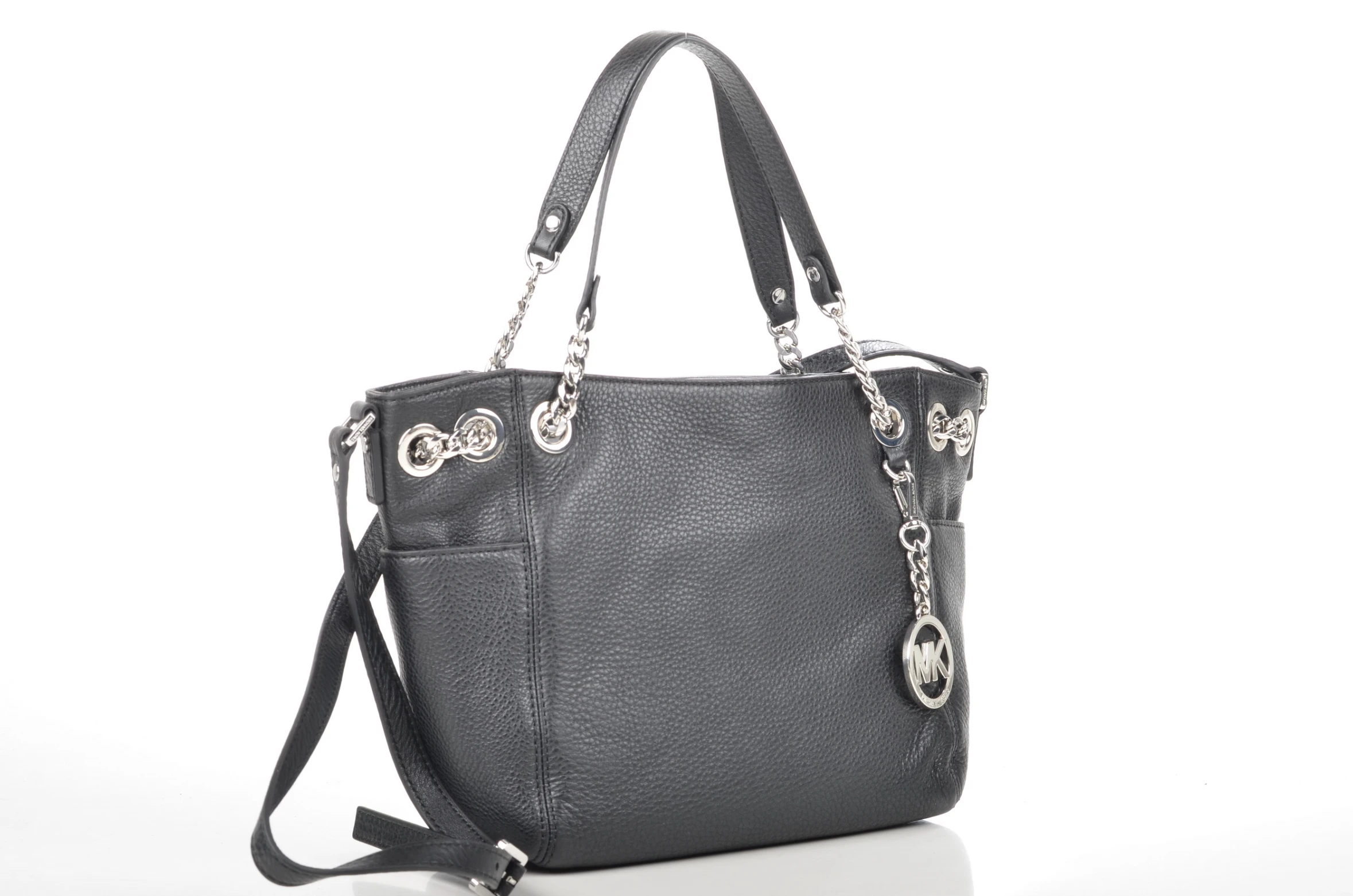 a gray handbag with a metal handle and chain straps