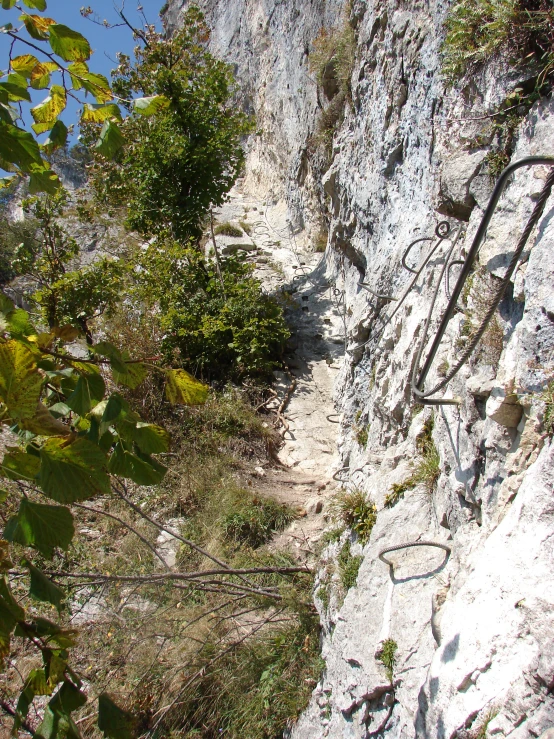 the narrow path is next to the very steep wall