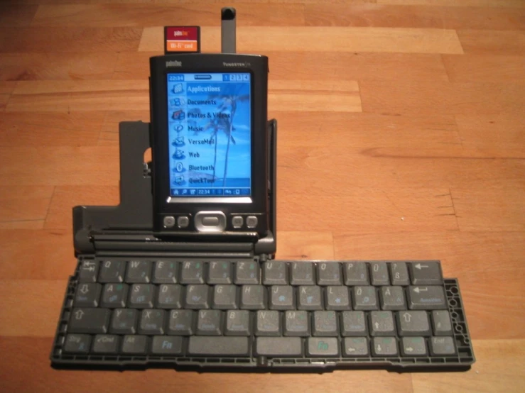 a smart phone with a keyboard attached to it