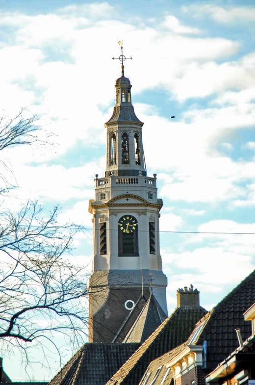 a clock tower on top of some houses