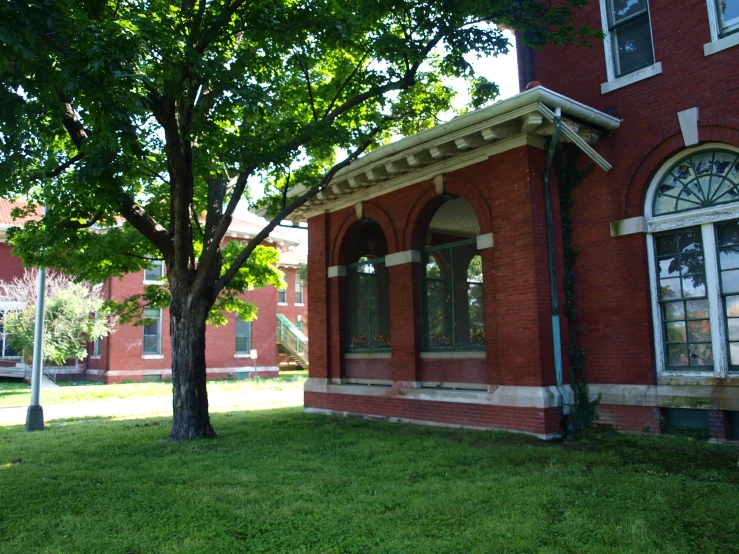 the house has many windows and a clock on it