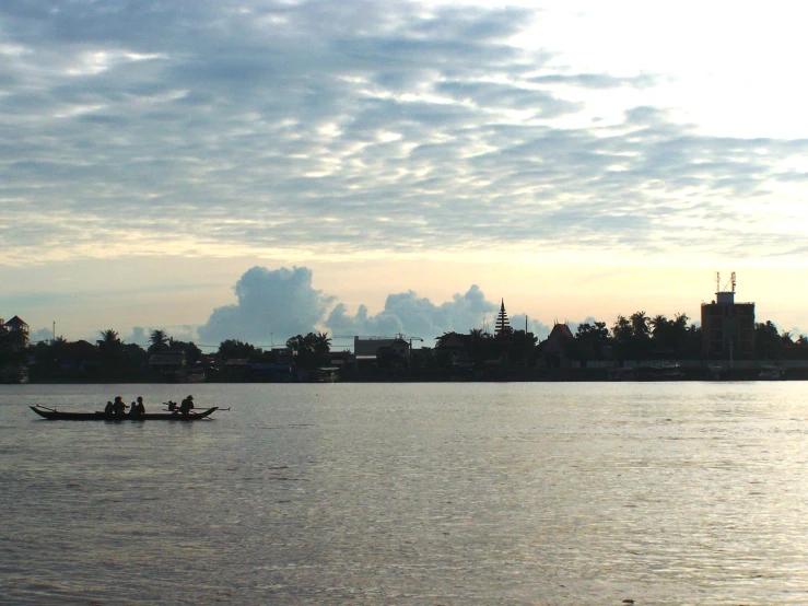 people on a boat in a body of water