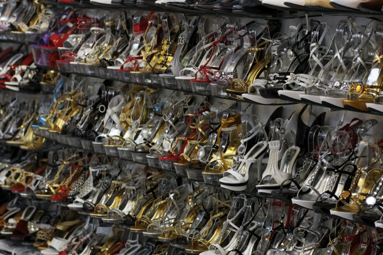 there is a rack filled with many different kinds of shoes