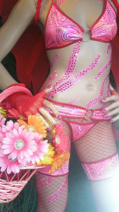 woman in a bright pink  and floral basket