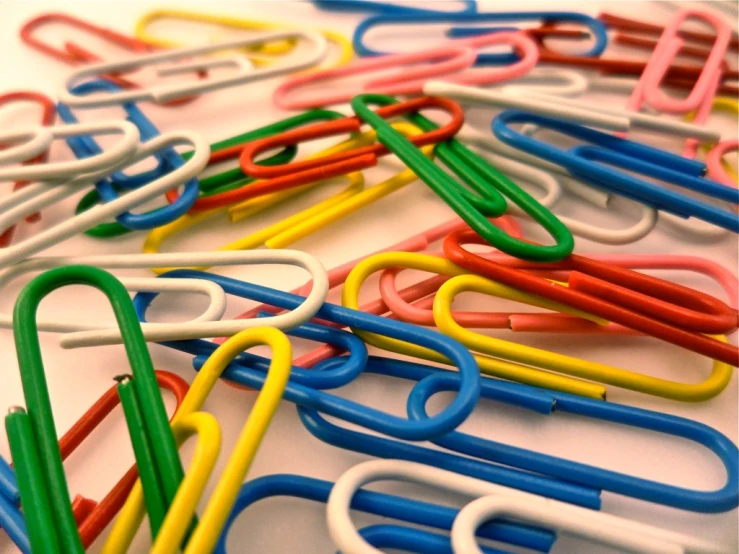 the paper clips are all together in various shapes