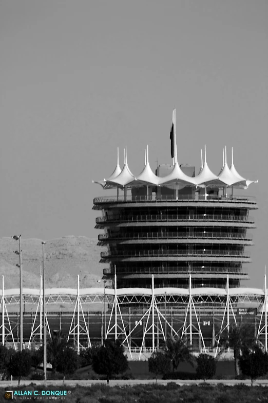 a very big building with lots of flags on top of it