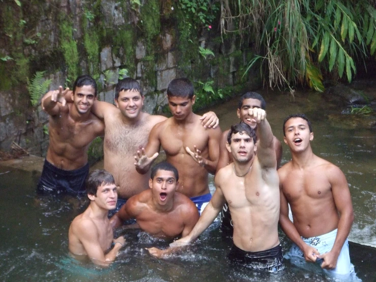 a group of people that are standing in the water