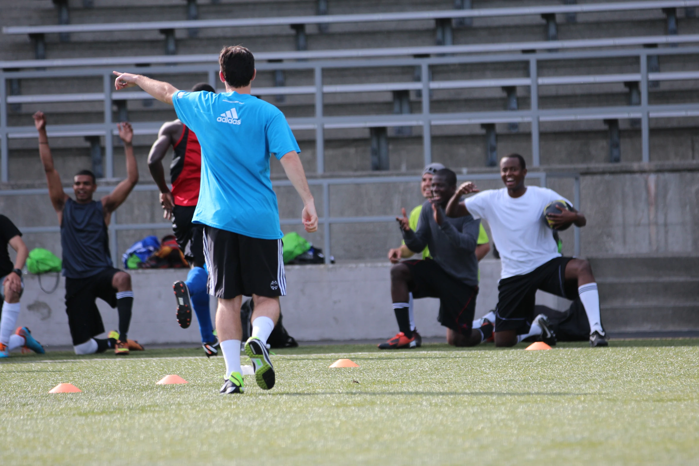 soccer players on grassy field during match play