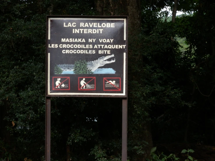 a sign that is telling visitors where the crocodiles are