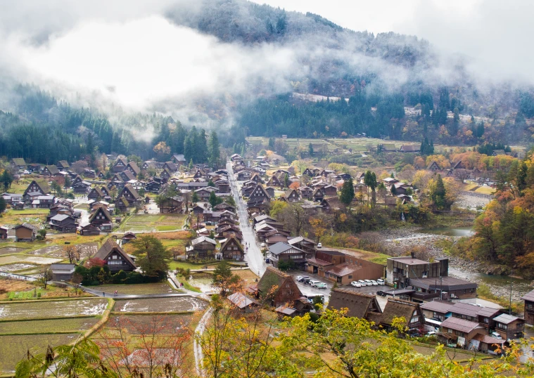 a small town with many trees surrounding it