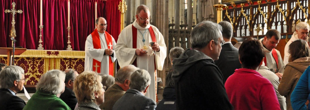 people standing at a ceremony in a church